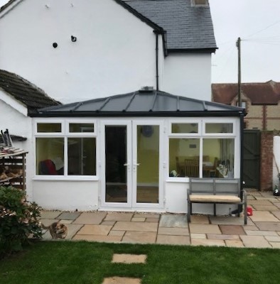 Conservatory with solid roof